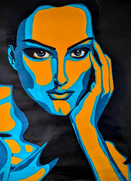 Portrait image of Natalie Portman in vibrant blues and yellows